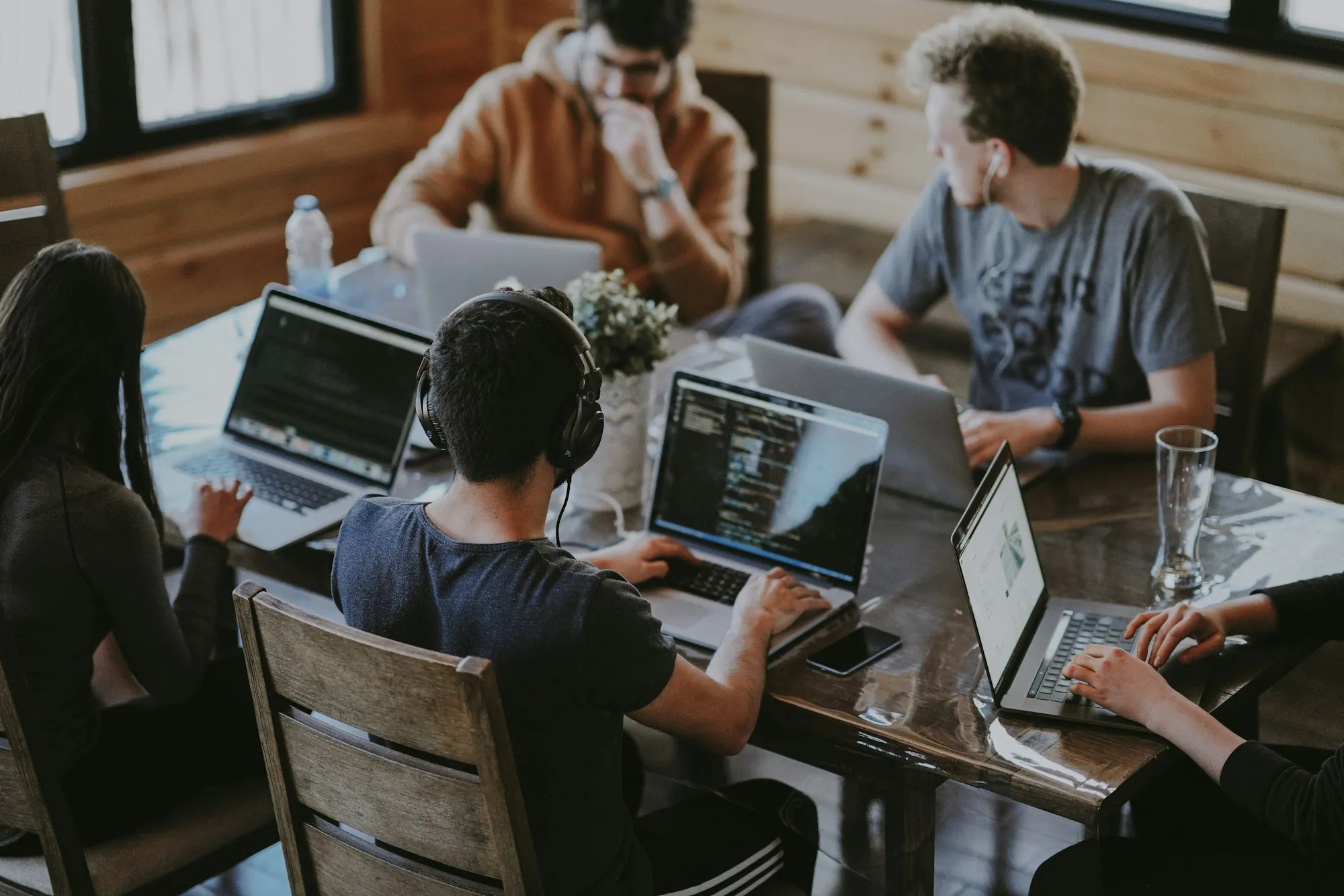 A group working through paperwork around a shared table